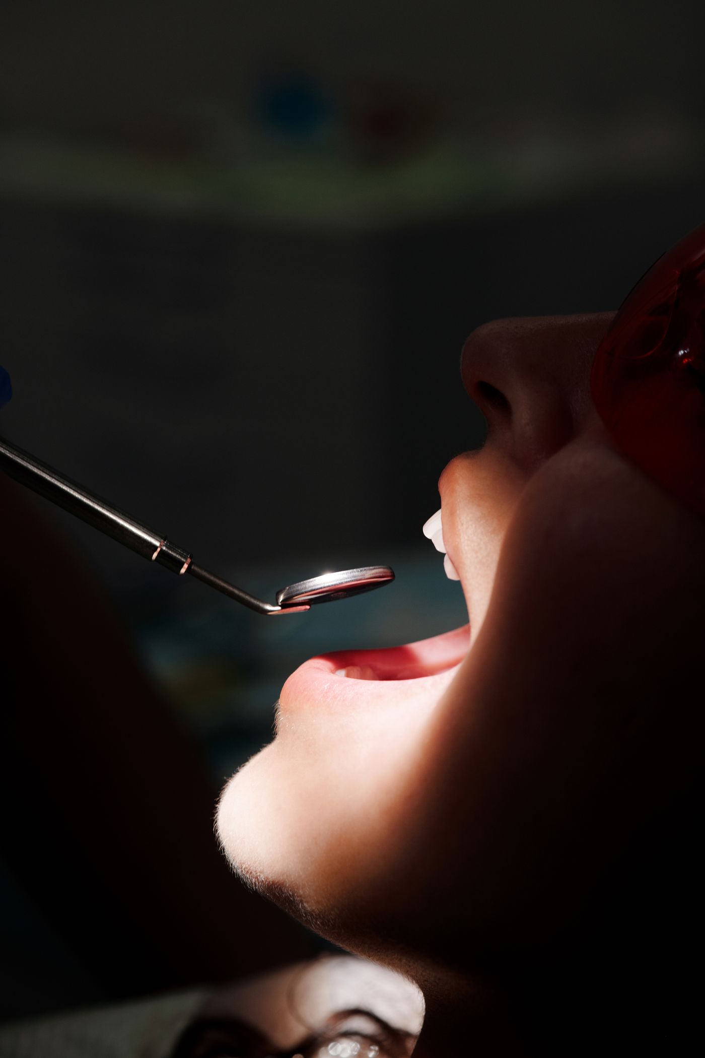 Close-up of a dental mirror during an examination